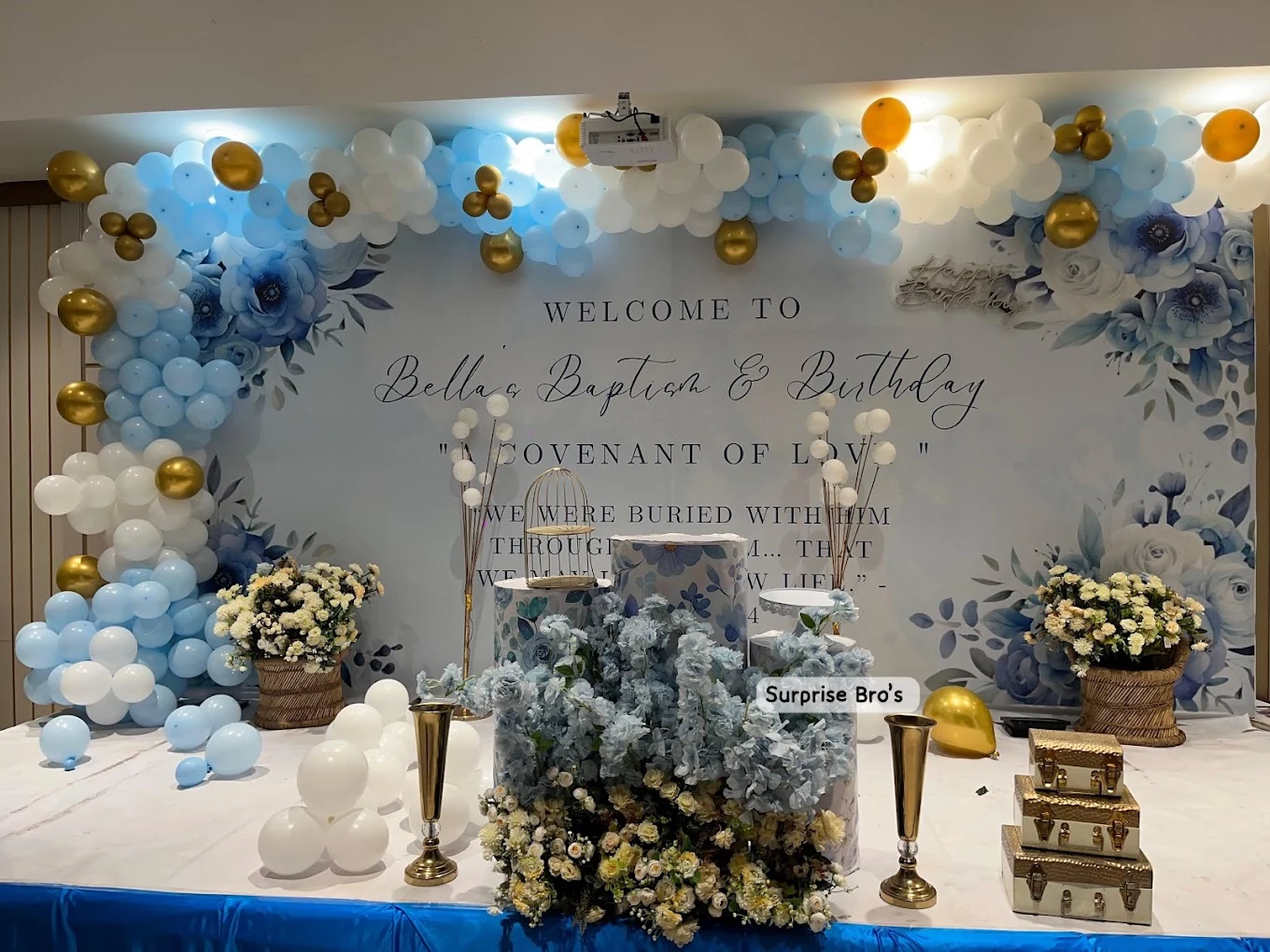 Blue and white baptism and birthday decorations with gold balloons